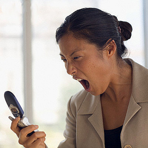 Businesswoman Shouting at Cell Phone