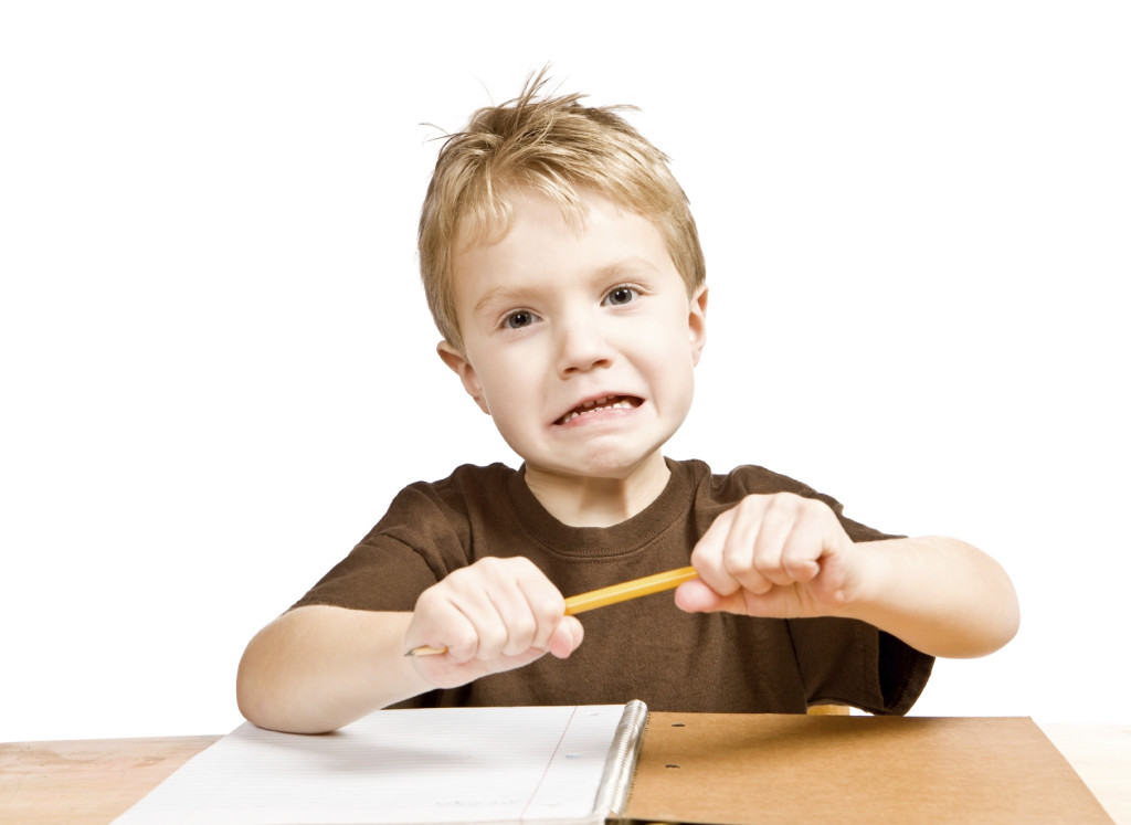 Frustrated-boy-breaking-pencil