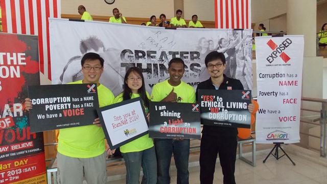 A team of people including Victor Chua (Founder of RunNat-far right) supporting EXPOSED