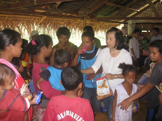 A sister-in-Christ passing out crackers