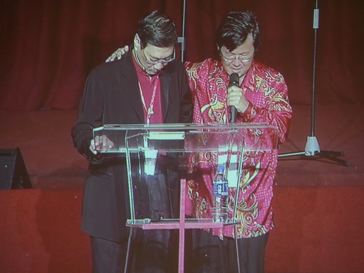 Pr Edmund Chan (left) being prayed for