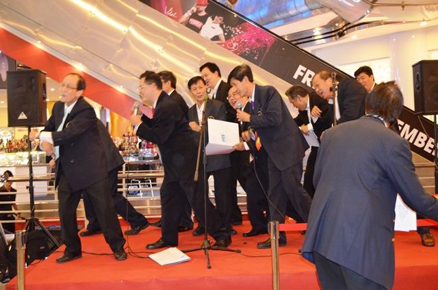 FGB members dancing on stage while singing