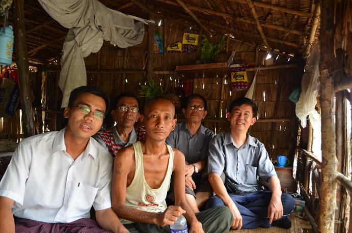 Tommy Chen (right most) with the pastors of Myanmar visiting the young man (middle) before he accepted Christ