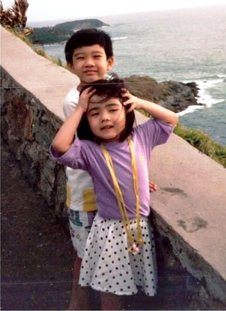 Carey Ng with her older brother, during her younger days