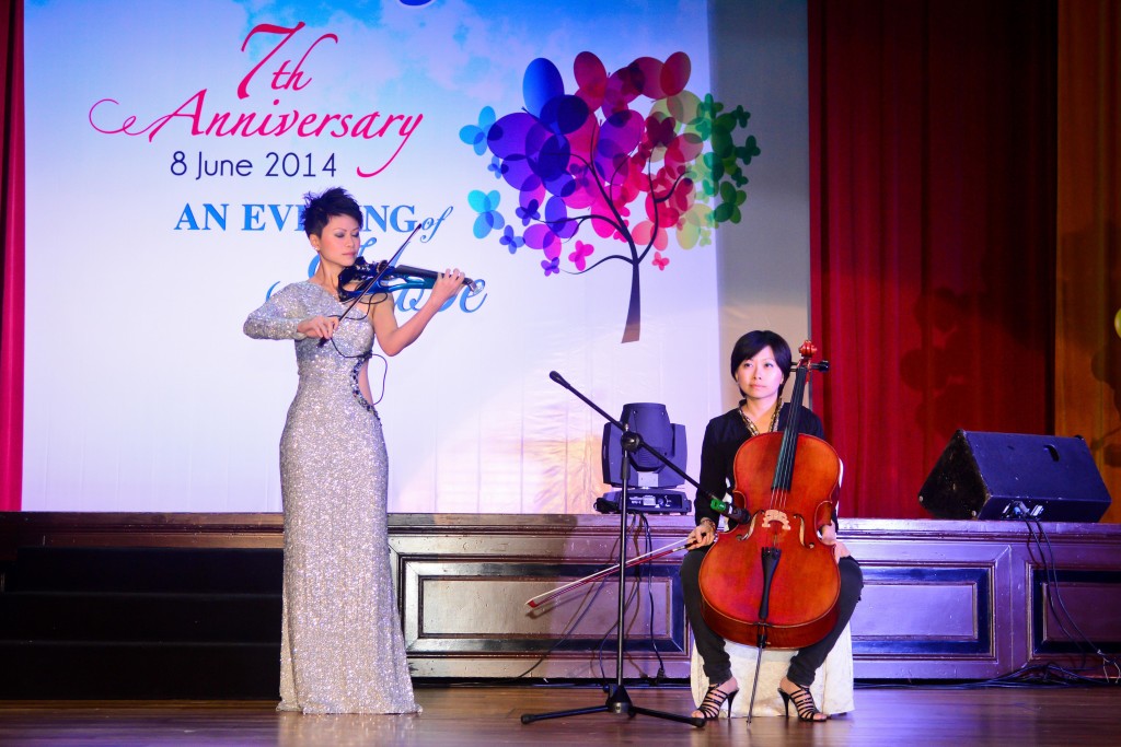 Dr Joanne Yeoh (left) performing onstage with her sister