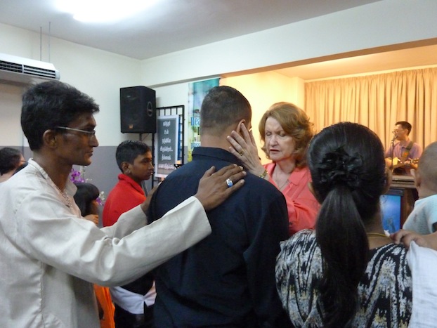 Ina, wife of Pr Johan, praying for the body of Christ