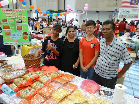 Elizabeth Ratnam (2nd from left) at her booth