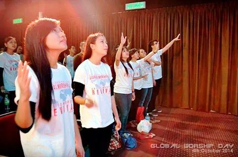 The young adults and youths worshiping God at Bible College Malaysia