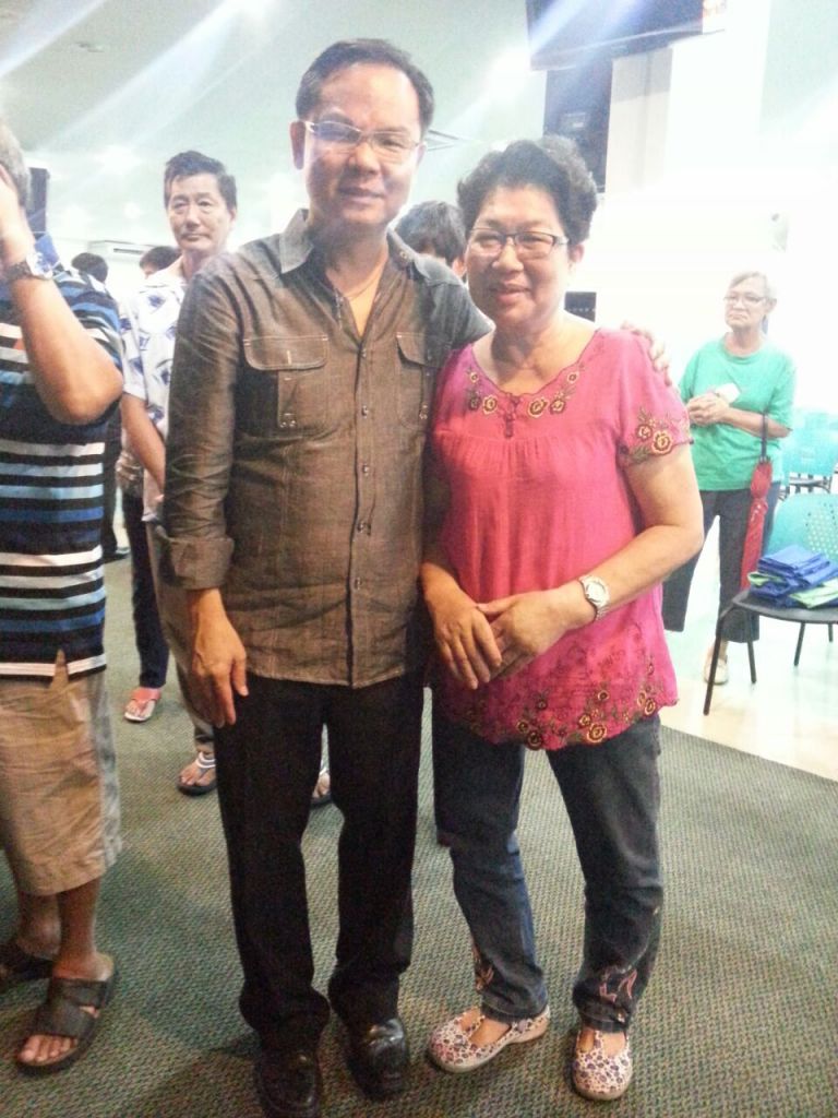 Eddy Yong (left) with an attendee of the FGA Healing Service