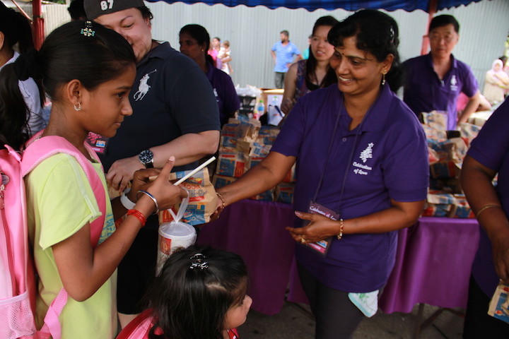 The volunteers of the event handing out goodies