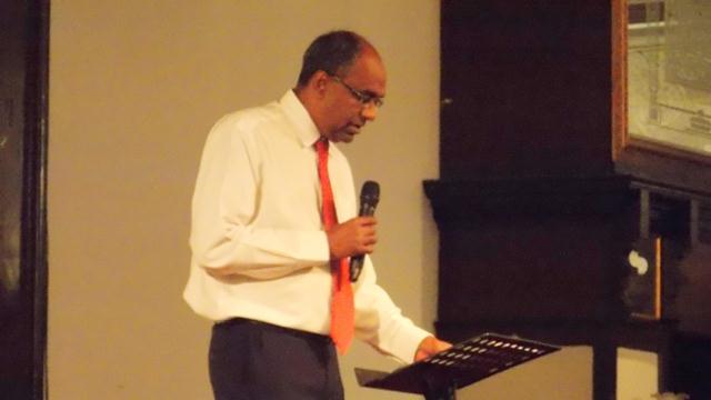 Pastor Suresh preaching the Word