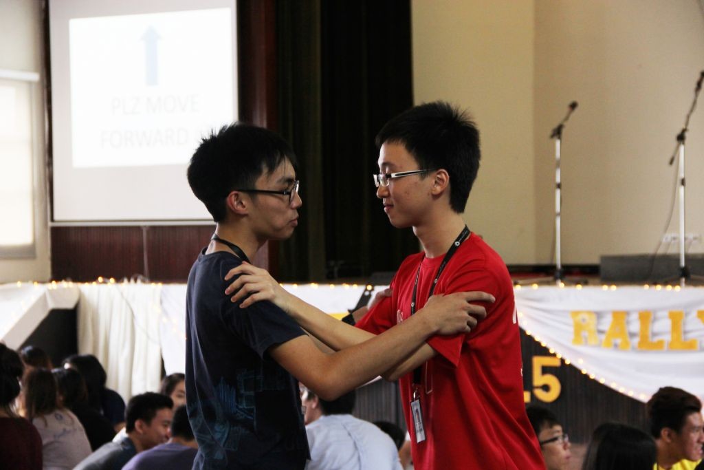 Two MCKL students greeting each other before the rally started 