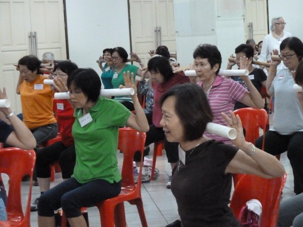 The participants working out with the rod they were provided