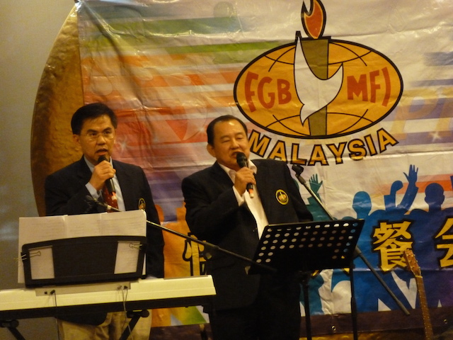 Bro HP (left) sharing his testimony of God healing his cancer