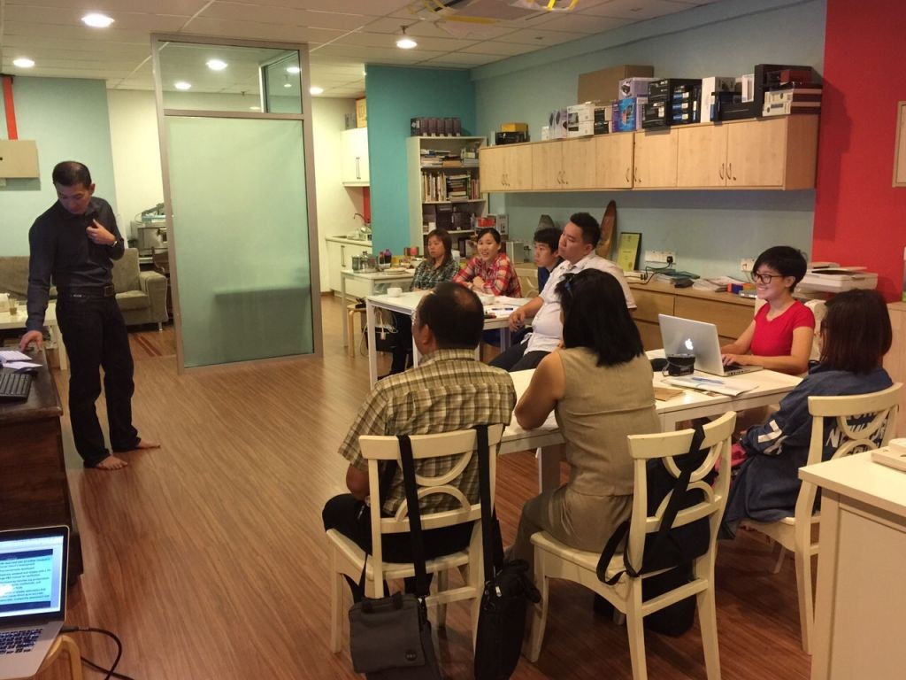 Terence Jiam holding a CD training session with consultants