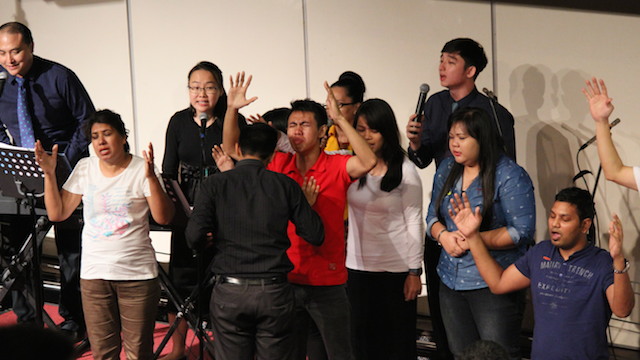 Attendees of the healing rally awaiting God to touch them with His Spirit and fire