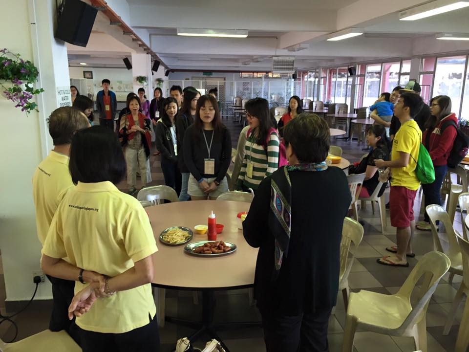 Singing the Doxology before breakfast Photo Credit: Samuel Ong