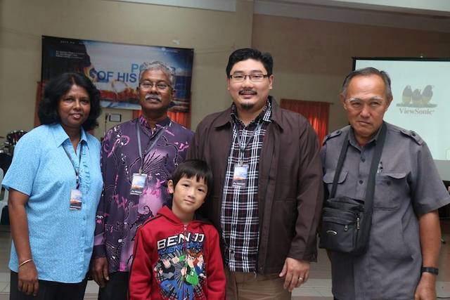 Gnanam (first from left) and Pastor Moses (second from left) with Damien Chua (second from right) and a brother-in-Christ