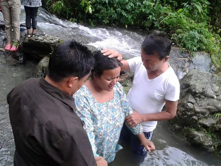 Yohang Sunbba's mother getting baptized. 