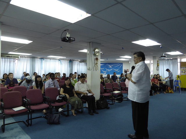 Pastor Alan Tan preaching to the congregation of the First Assembly of God in Kota Bahru, Kelantan