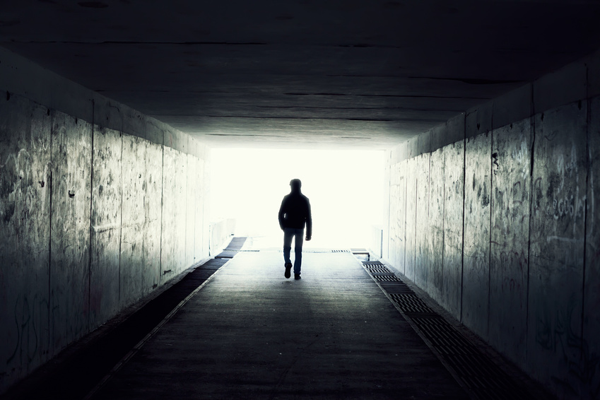 silhouette in a subway tunnel. Light at End of Tunnel