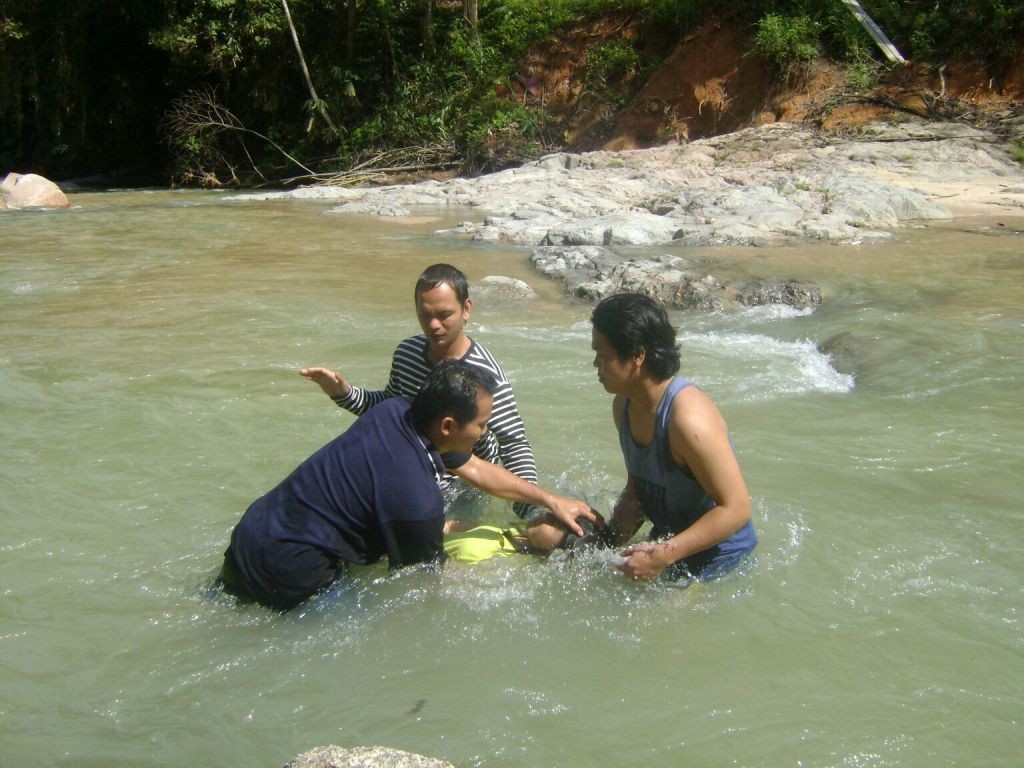 Pastor Nick baptizing his church members