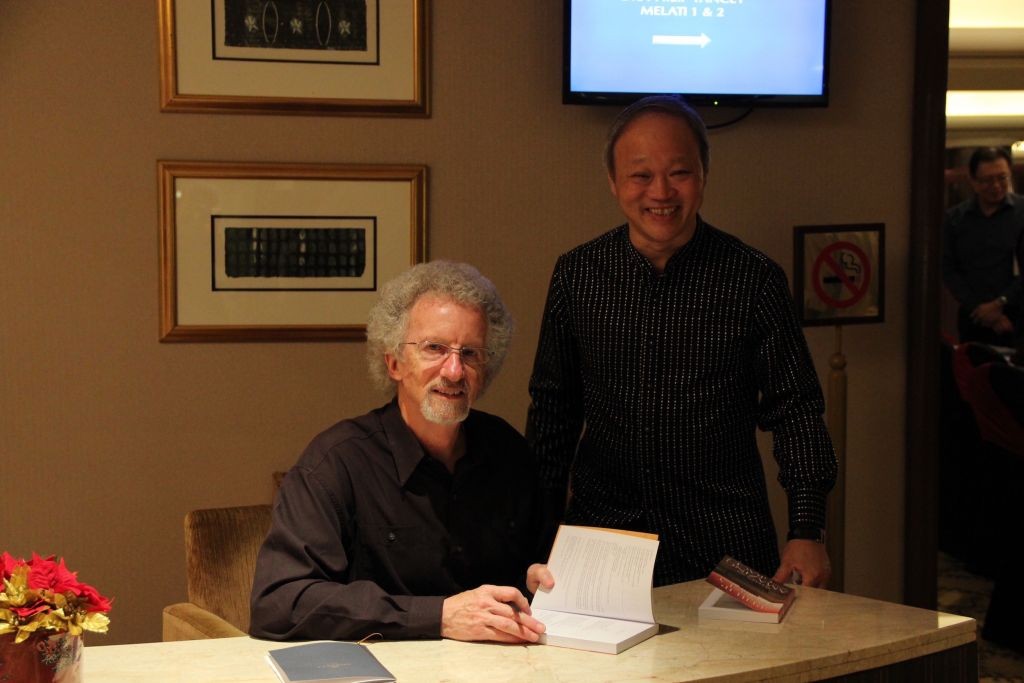 Dr. Yancey signing books for the church leaders 