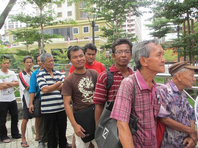 The street people lining up for food in the H. O. P. E. ministry founded by Veron for the street people