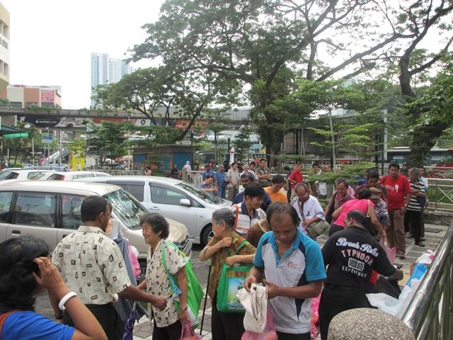 The long line of street people queuing up for food 