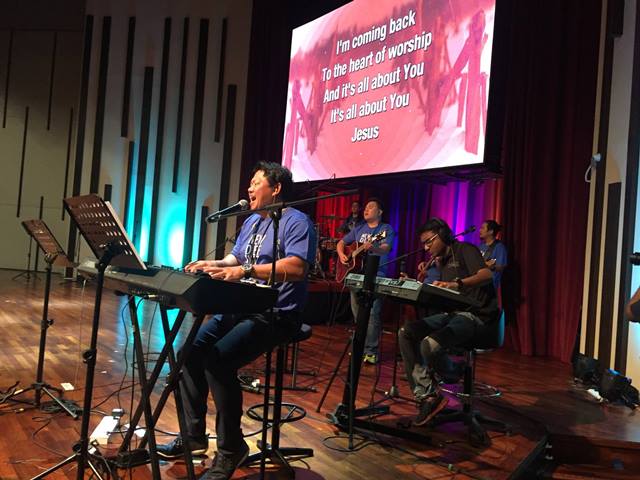 Patrick Leong from Grace Assembly leading in worship.