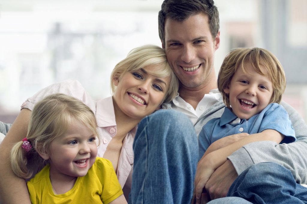 family happy kids couch iStock_000008092663Medium