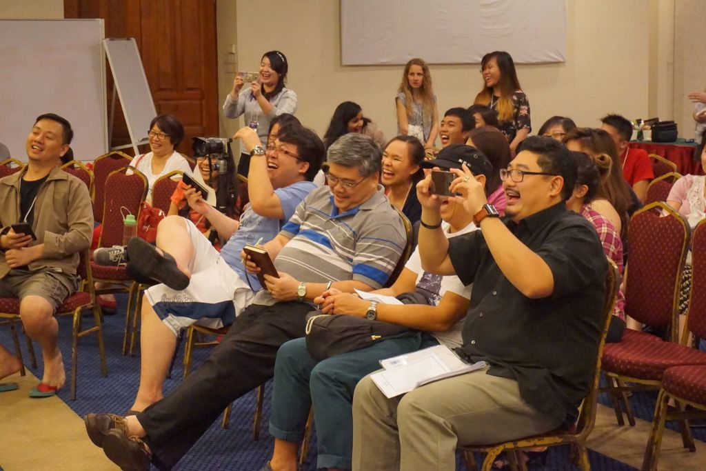 Pastor Damien Chua (closest) and Pastor Alan Tan (third from right) enjoying the skit in the Exponential camp